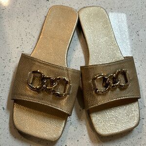 Champagne gold colored sandals.
